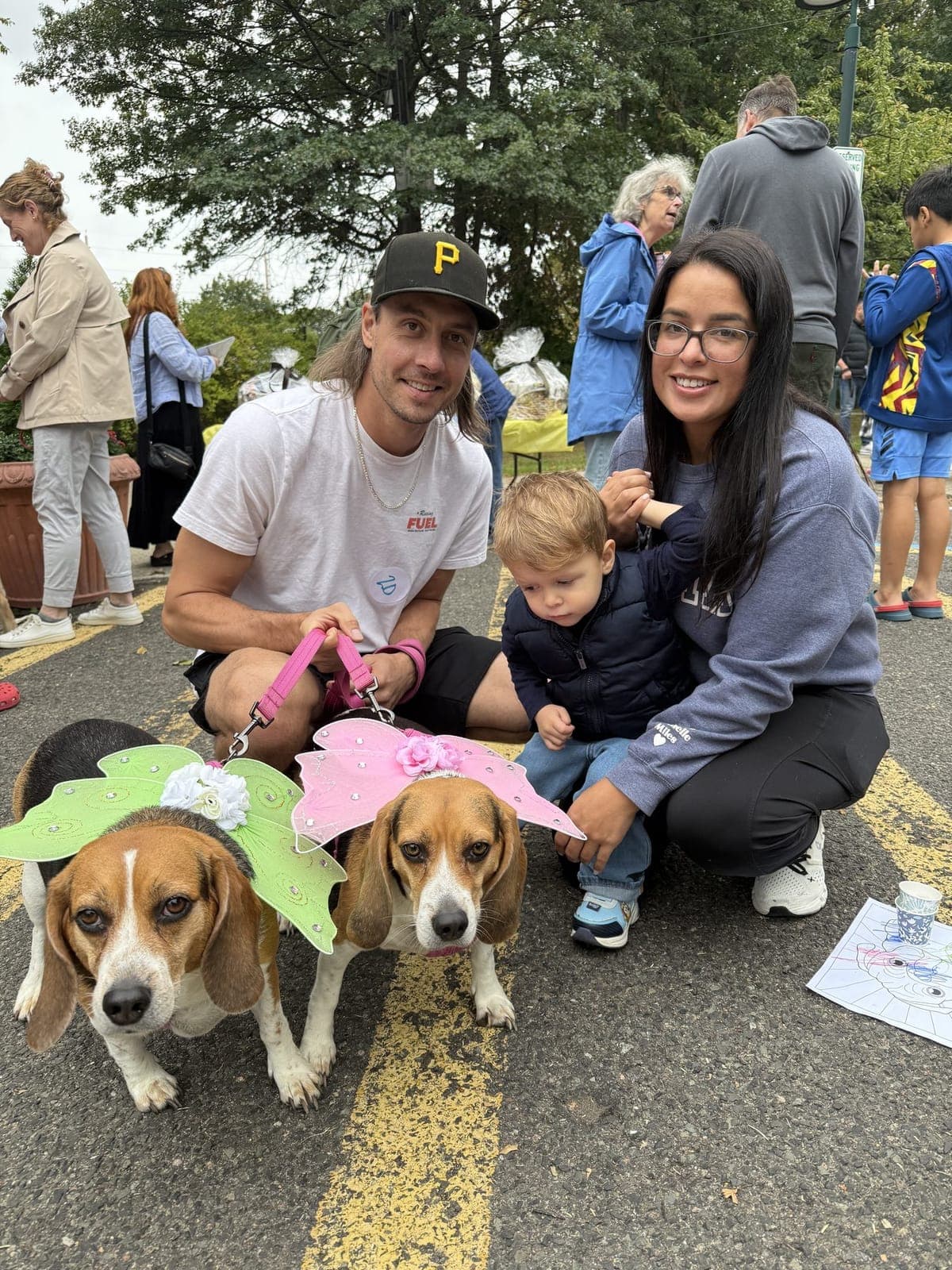 Two beagles show off fairy wings at the costume event.