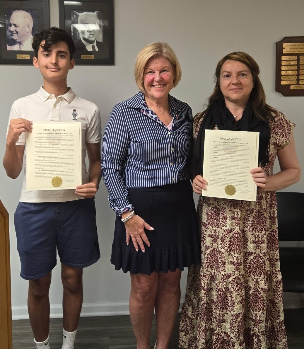 The Aliver Foundation’s Teen Ambassador Sebastiao Pinto and First Responder Committee Member Luciane Raibin join Mayor Colleen Mahr with the Sudden Cardiac Arrest Awareness Month proclamation.
